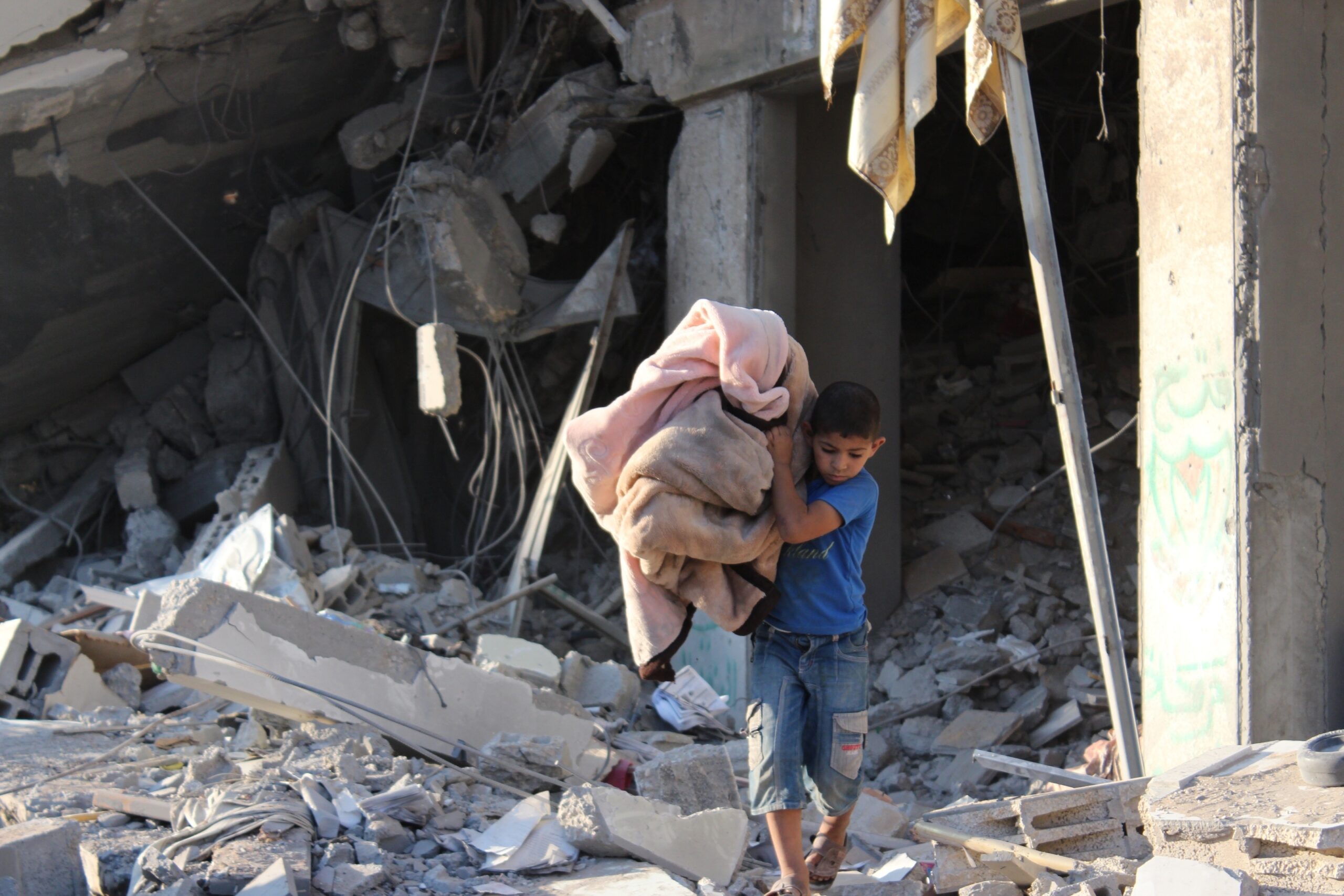 Palestine,,Gaza,-,March,1,2023:,Children,Gather,Near,A,Destroyed,Building